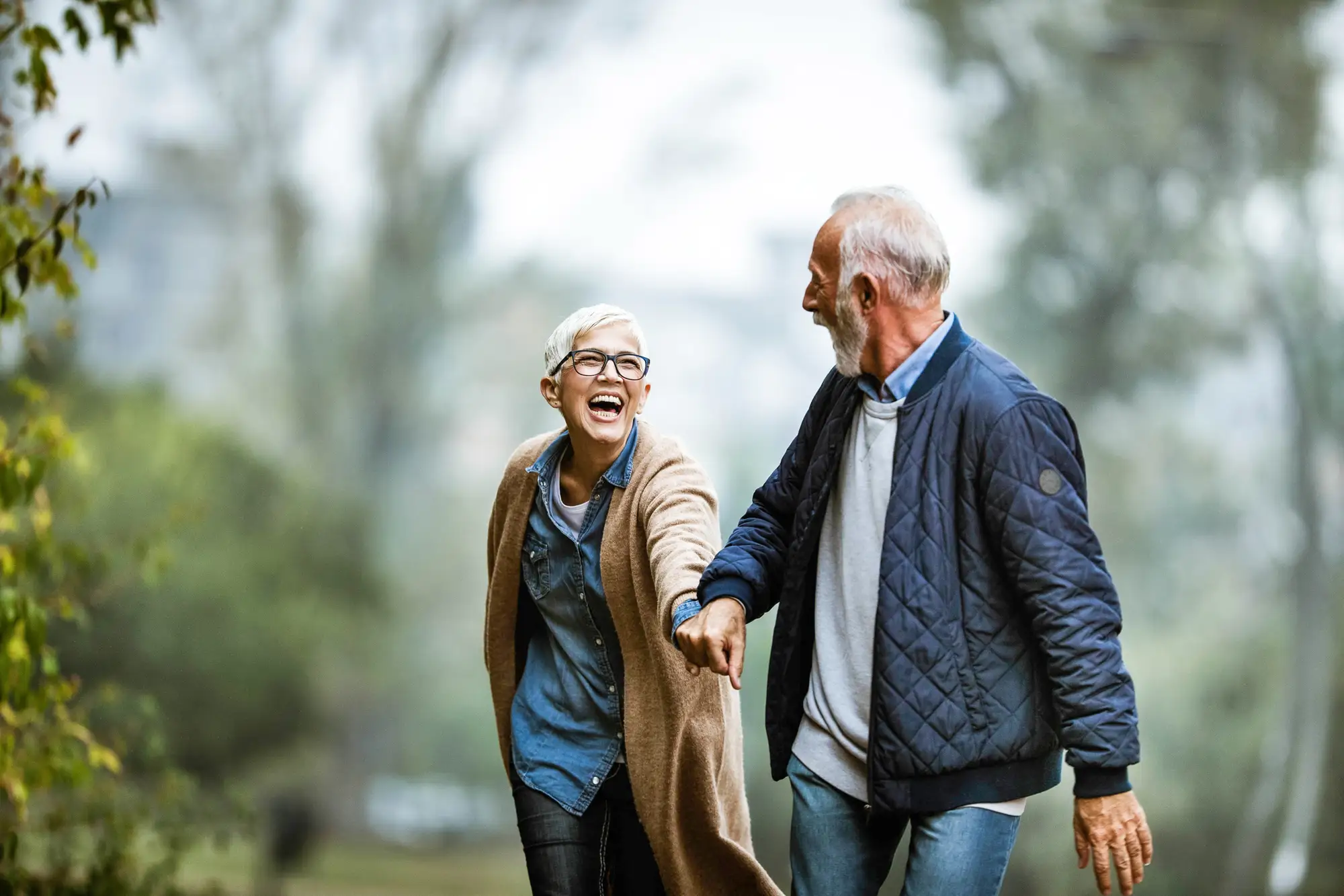 seniors holding hands and going for a walk, enjoy living in a Life Plan Community