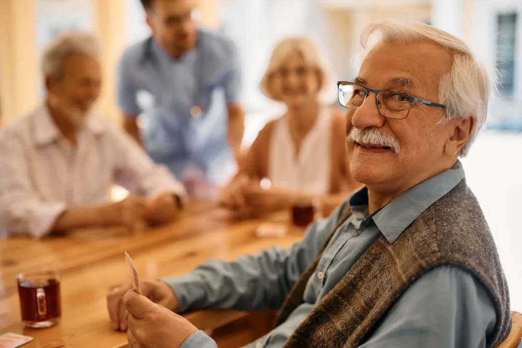 Elderly people enjoying a card game.